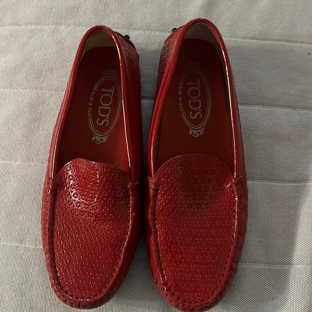 TODS patent red brand new loafer. Only tried one time inside the house .